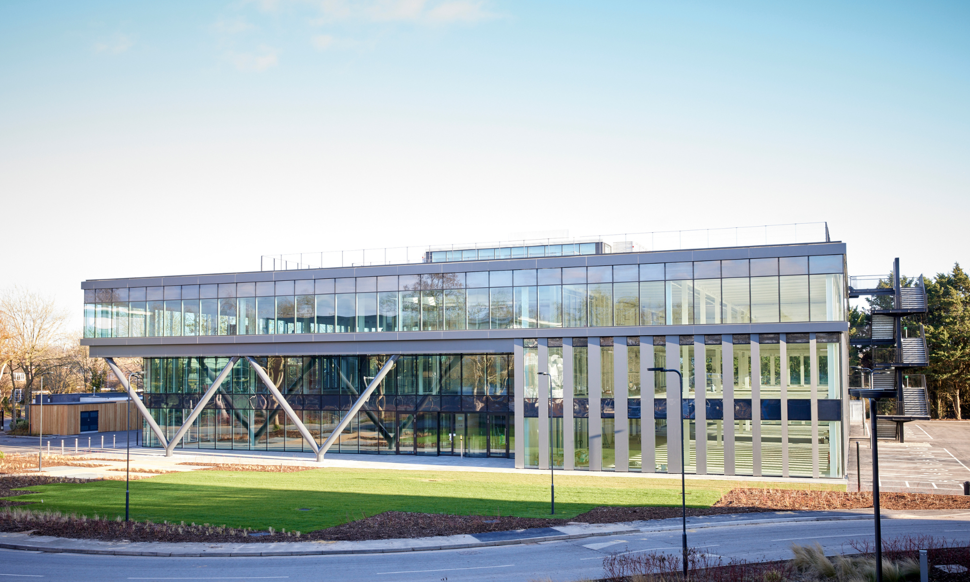 Large, glass fronted building on a sunny day