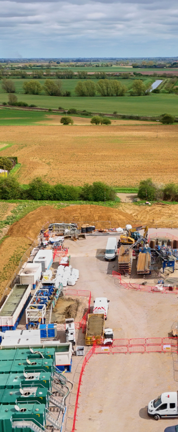 Aerial shot showing drilling area, and fields beyond